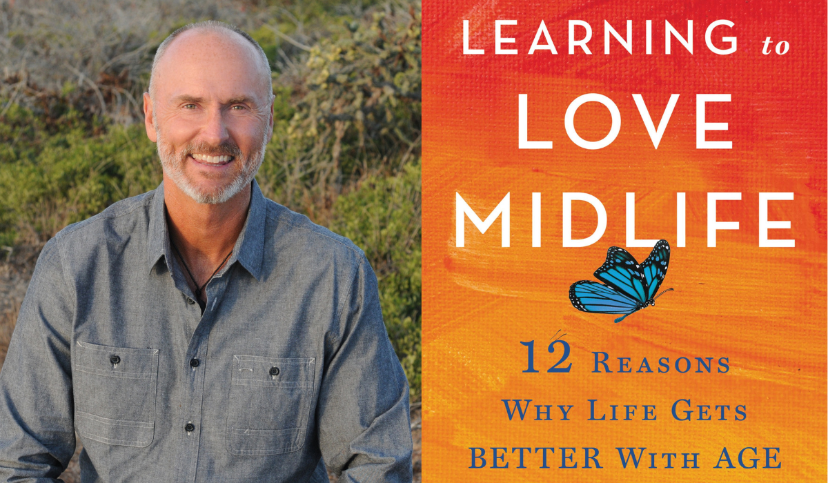 Chip Conley with white grey hair in button down. Next to orange and red book cover: Learning to Love Midlife.