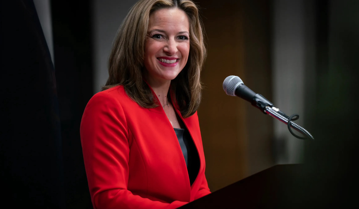 Jocelyn Benson speaking into a microphone