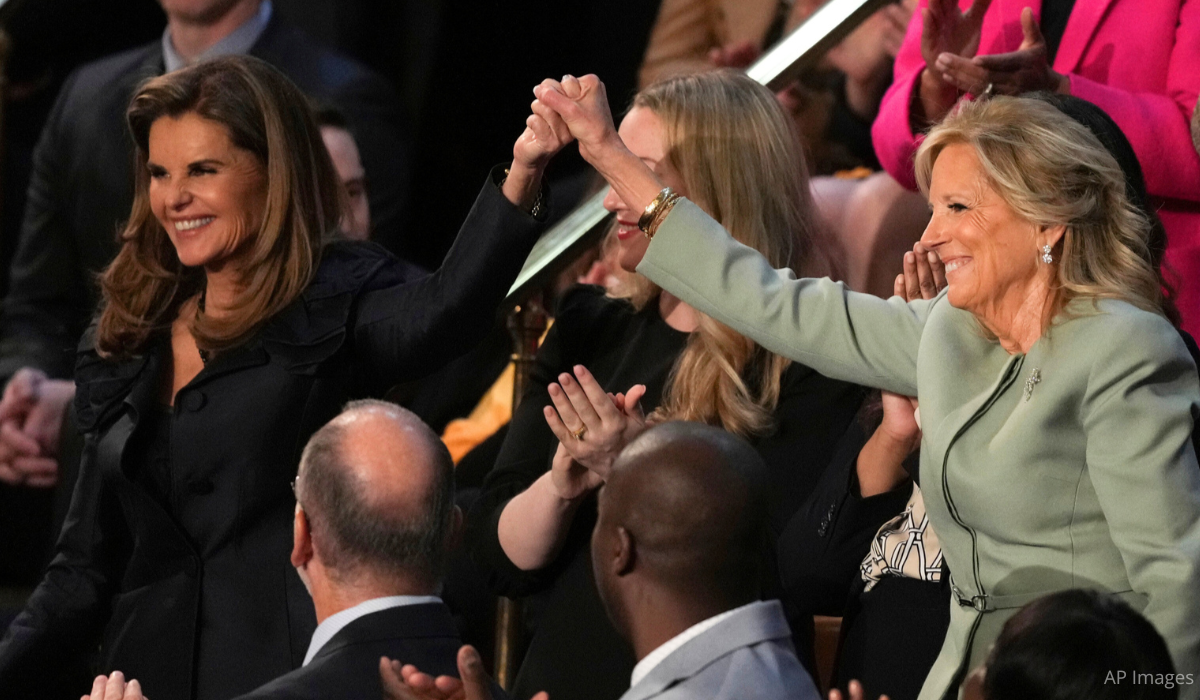 Maria Shriver and First Lady Jill Biden lock hands at the 2024 State of the Union Address.
