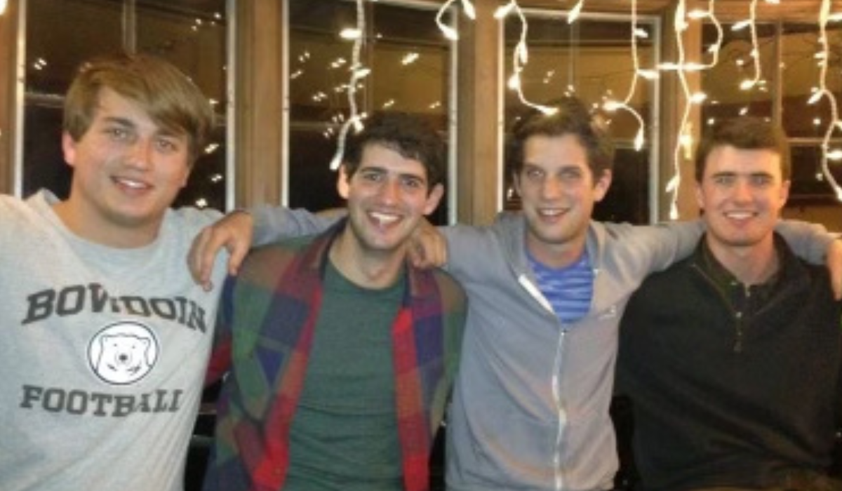 Evan Gershkovich and Simon Brooks in college with two friends.