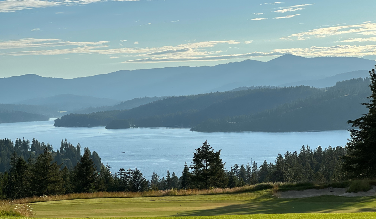 Scenic nature view of lake and mountains.