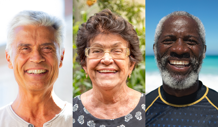 Three older individuals, one woman and two men smiling big.