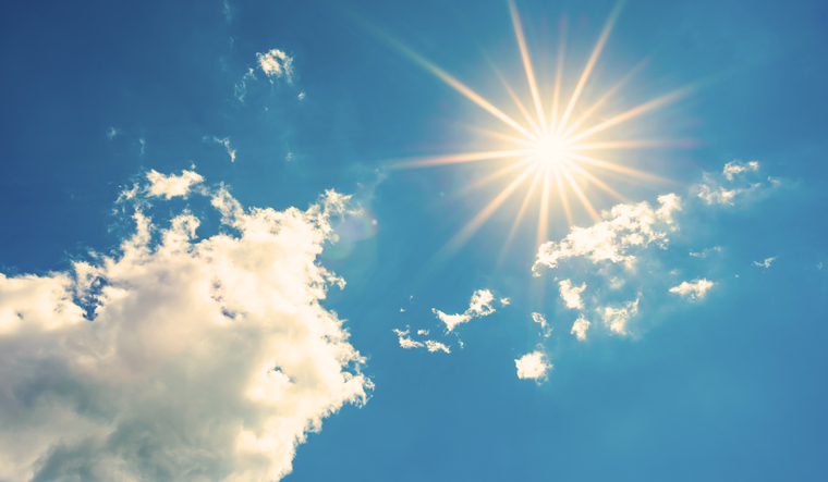 A bright sun and a blue sky.