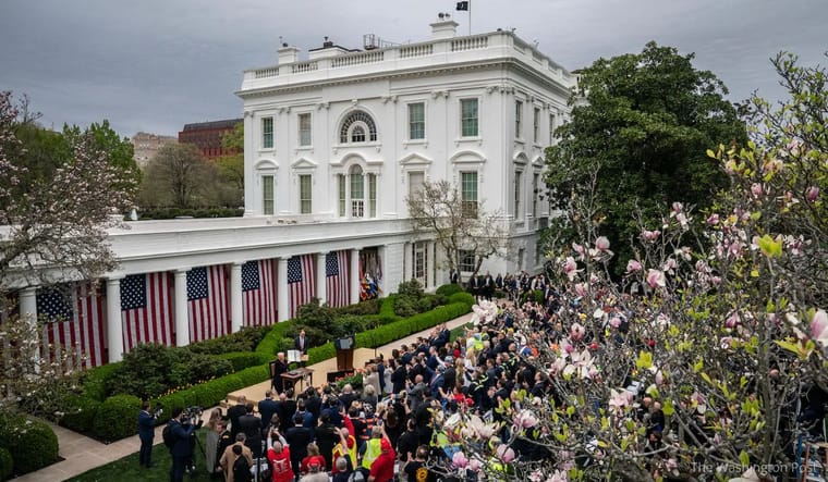 President Donald Trump signs executive orders on tariffs in the Rose Garden on Wednesday, April 2, 2025. 