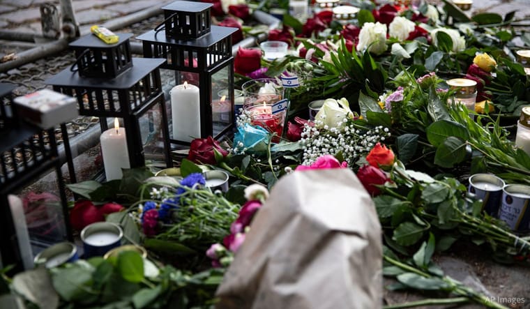 A memorial with flowers and candles in Berlin on May 22, 2025 to mourn two Israeli Embassy staff killed in Washington, D.C. AP Images.