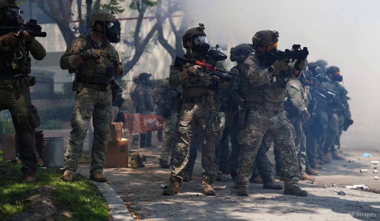 Law enforcement stand during a protest in Los Angeles, Saturday, June 7, 2025 (AP Photo/Eric Thayer).