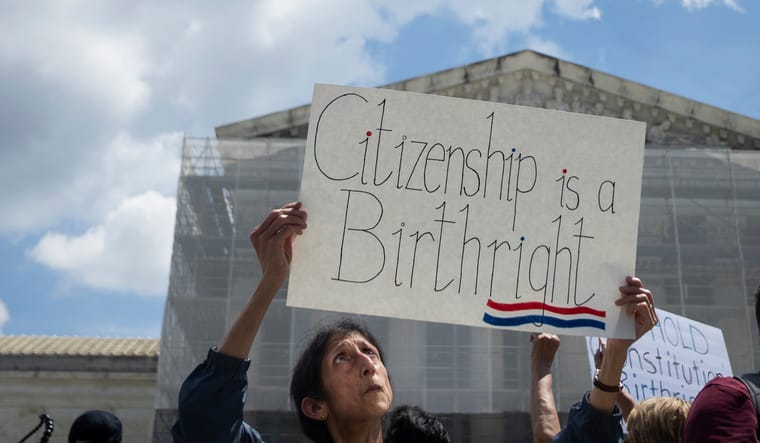 Woman protesting holds up a sign titled "citizenship is a birthright." Washington, D.C., May 15, 2025. Photo by Allison Bailey/NurPhoto via AP.