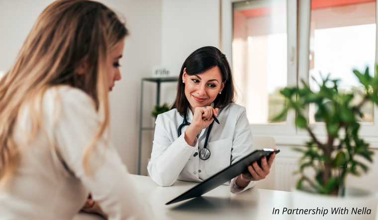 A woman and doctor going over a report.