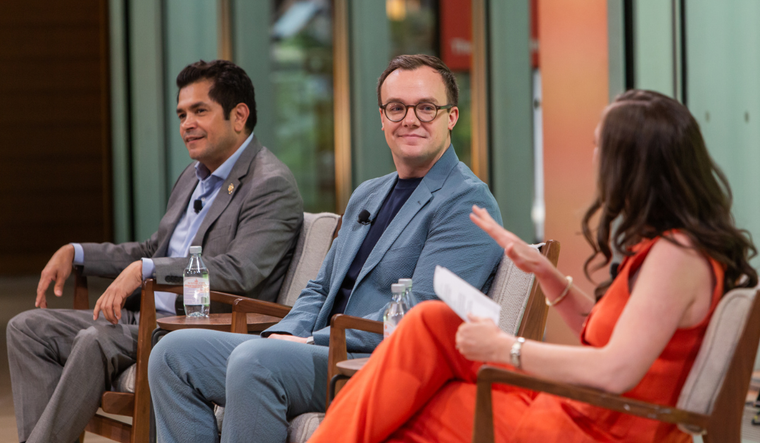 Reshma Saujani speaks with others on a panel.