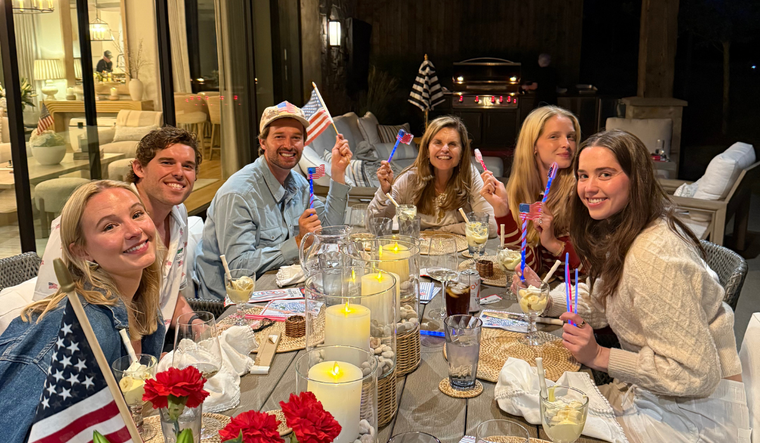 Maria and her family at a 4th of July themed dinner.