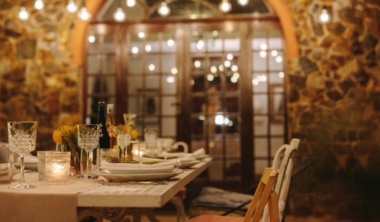 Thanksgiving table with empty chairs.