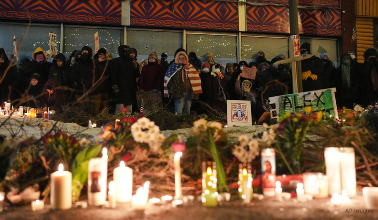 People gather during a vigil for 37-year-old Alex Pretti, who was fatally shot by a U.S. Border Patrol officer earlier in the day, Saturday, Jan. 24, 2026, in Minneapolis.
